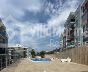 2+1 FLAT FOR SALE WITHOUT EXPENSES IN A SITE WITH POOL IN KUŞADASI....